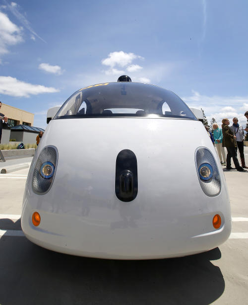 This May 13, 2015 photo shows the front of Google's new self-driving prototype car during a demonstration at Google campus in Mountain View, Calif. The car, which needs no gas pedal or steering wheel, will make its debut on public roads this summer. (AP Photo/Tony Avelar)