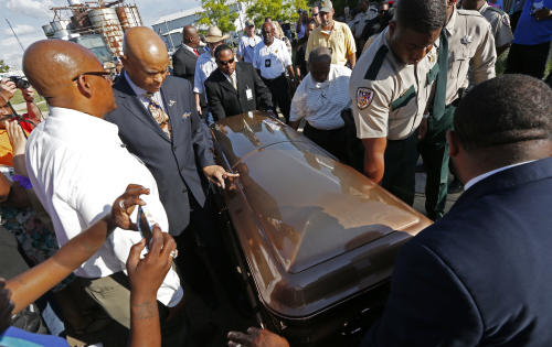 The casket bearing the body of blues legend B.B. King is wheeled to a waiting hearse in front of the B.B. King Museum and Delta Interpretive Center after a day of public viewing, Friday, May 29, 2015 in Indianola, Miss. The visitation comes a day before the funeral for the man who influenced generations of singers and guitarists. (AP Photo/Rogelio V. Solis)