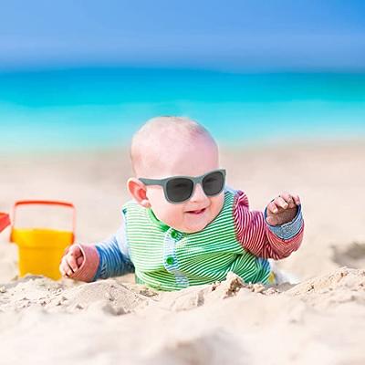 Cute 6 months old baby with Light brown hair in white, blue and brownish  long-sleeved shirt wearing blue googles is embraced and held by his mum  Stock Photo - Alamy