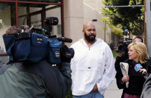 ** FILE ** In this Feb. 26, 2003 file photo, rap music mogul Marion "Suge" Knight, walks out of the Los Angeles County jail in Los Angeles. Knight appeared in a Los Angeles courtroom on Tuesday, Dec. 23, 2014, and was ordered to return to court on Jan. 27, 2015, for the next hearing in a felony robbery case filed after a celebrity photographer reported that he stole her camera in September. (AP Photo/Damian Dovarganes, File)