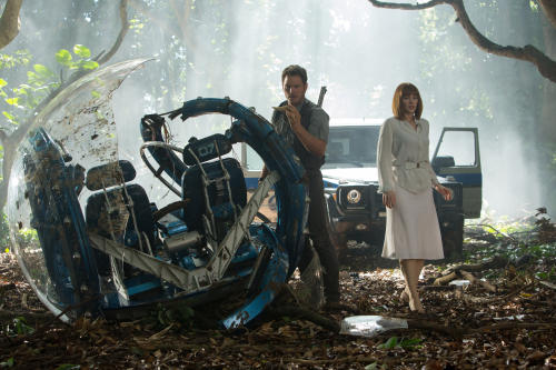 This photo provided by Universal Pictures shows, Chris Pratt, left, and Bryce Dallas Howard in a scene from the film, "Jurassic World," directed by Colin Trevorrow, in the next installment of Steven Spielberg's groundbreaking "Jurassic Park" series. The 3D movie releases in theaters by Universal Pictures on June 12, 2015. (Chuck Zlotnick/Universal Pictures via AP)
