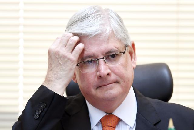 Brazil's Prosecutor General Rodrigo Janot takes part in the opening of the Brazil-Japan Seminar on Fighting Corruption, in Brasilia, on June 19, 2017. The opening of an investigation by Rodrigo Janot came close to bringing President Michel Temer down three weeks ago, but the conservative president has since dug in and defied Janot in dramatic fashion by ignoring a deadline to supply a written deposition. / AFP PHOTO / EVARISTO SA (Photo credit should read EVARISTO SA/AFP/Getty Images)