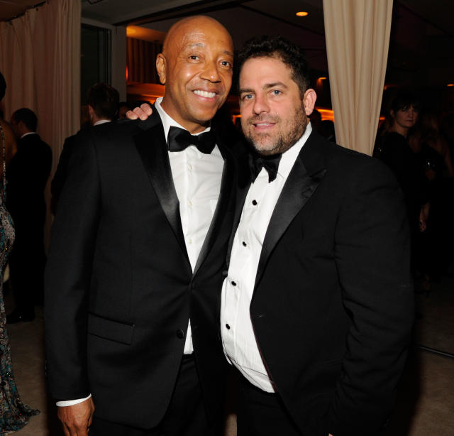 Russell Simmons (left) has been accused of forcing himself on a 17-year-old model and sexually assaulting her while Brett Ratner watched. (Kevin Mazur/VF13 via Getty Images)