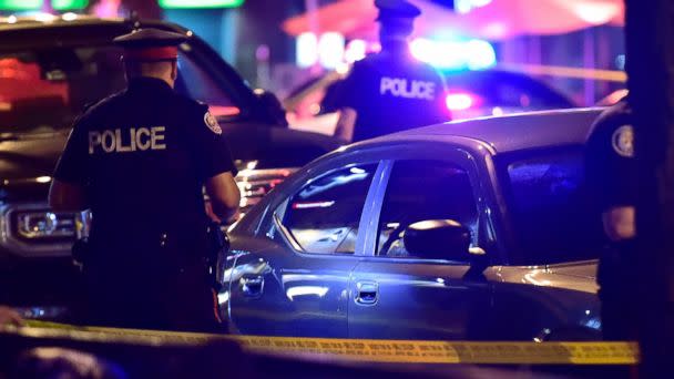 Police work the scene of a shooting in Toronto on Sunday, July 22, 2018. [AP)