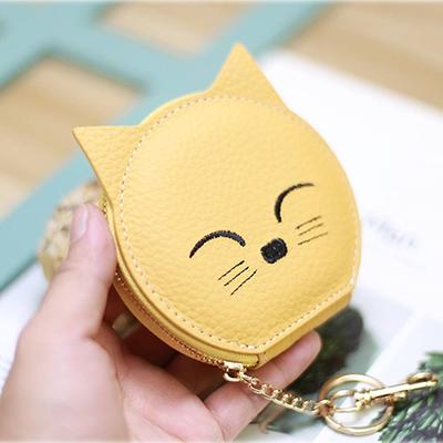 Round soft fabric cat face purse with long cross the body shoulder strap.  Size Approx : 11x10cm. Lined with white fabric.