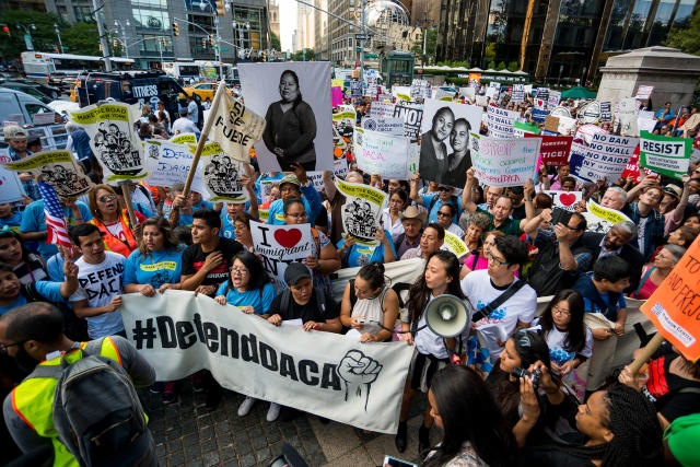 Activists rally in Columbus Circle and marched to Trump Tower in protest of President Donald Trump's possible elimination of the Obama-era