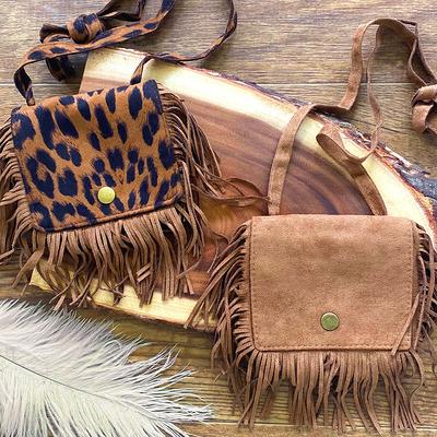 cow print purse with fringe