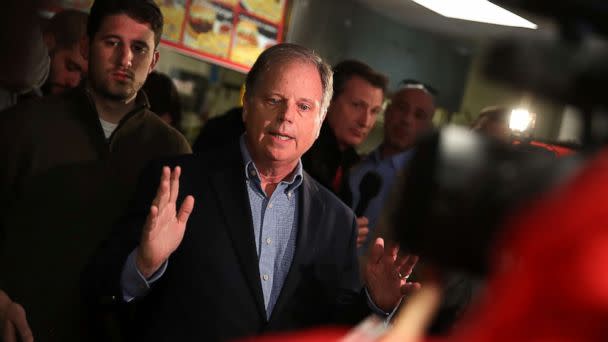 PHOTO: Doug Jones talks with reporters during a campaign stop at restaurant Chris Z's, Dec. 11, 2017, in Birmingham, Ala. (Justin Sullivan/Getty Images)