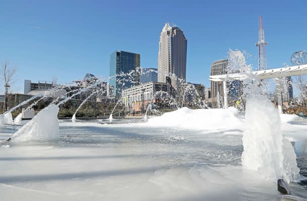 PHOTO: Water squirts from a frozen fountain near downtown in Charlotte, N.C., on Jan. 2, 2018. (Chuck Burton/AP)