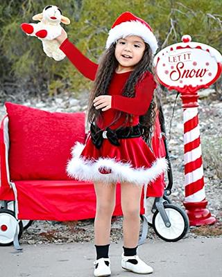 A baby girl in a red, winter themed outfit Stock Photo - Alamy