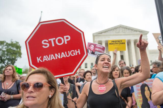 Demonstrators protest the imminent confirmation of Supreme Court nominee Brett Kavanaugh at the Supreme Court on Oct. 6. (Photo: RobertoSchmidt/AFP/Getty Images)