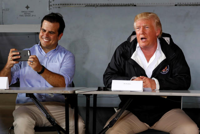 Puerto Rico Gov. Ricardo Rossello, left, takes a picture as he and President Donald Trump receive a briefing on hurricane relief efforts on Oct. 3, 2017. (Jonathan Ernst / Reuters)