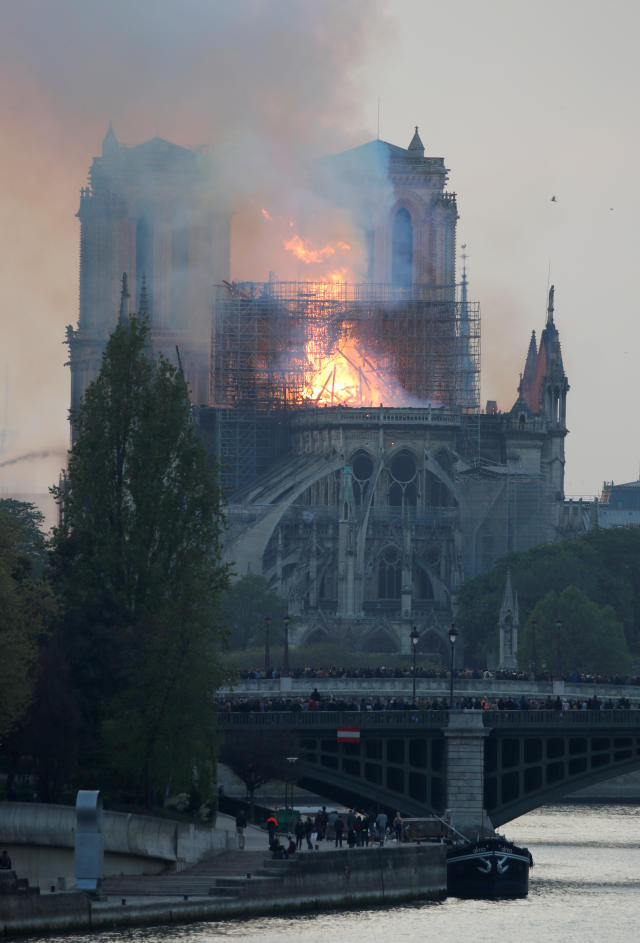 Smoke billows from Notre Dame Cathedral after a fire broke out, in Paris, France April 15, 2019. REUTERS/Charles Platiau