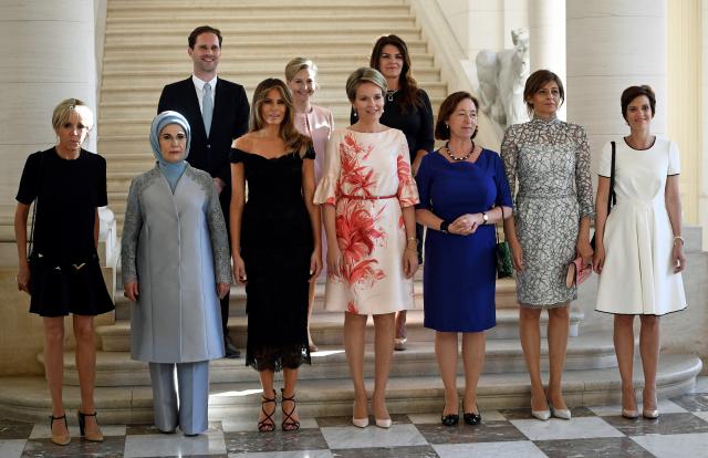 The spouses of NATO leaders gather for a photo before dinner at the Royal Castle in Laeken. (YORICK JANSENS via Getty Images)