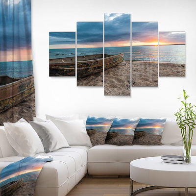 Designart 'Rusty Row Boat on Sand at Sunset' Seascape Large Disc Metal Wall Art