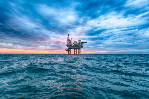 An offshore jackup rig at dusk.