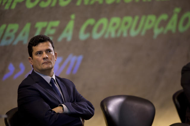 Former Judge Sergio Moro participates in an anti-corruption conference in Rio de Janeiro, Brazil, Friday, Nov. 23, 2018. Moro said he would present a bill to fight corruption and organized crime in February and reiterated that he had been given carte blanche by the President-elect to carry investigations. (AP Photo/Silvia Izquierdo)