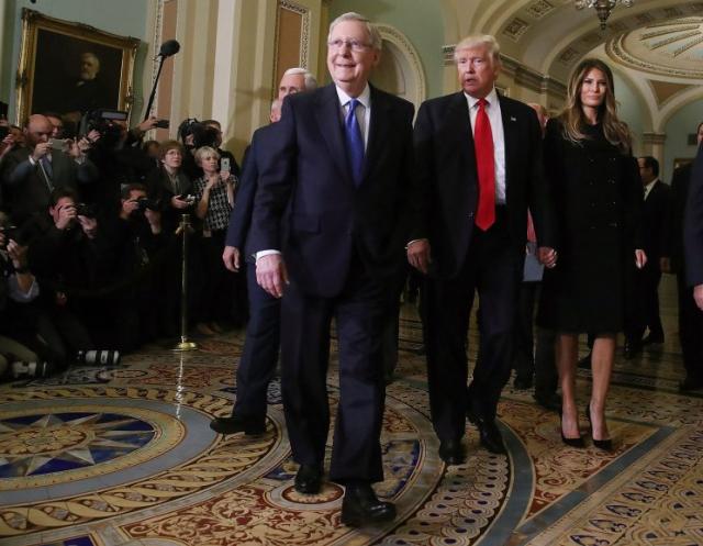 Senate Majority Leader Mitch McConnell (2L), walks with President-elect Donald Trump, his wife Melania Trump, and Vice President-elect Mike Pence (L), at the U.S. Capitol for a meeting November 10, 2016 in Washington, DC. Earlier in the day president-elect Trump met with U.S. President Barack Obama at the White House. (Mark Wilson/Getty Images)