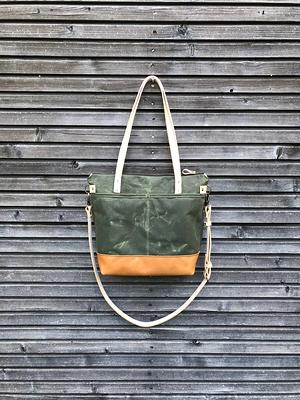 Waxed canvas leather tote bag in olive green with zipper closure and cross  body strap