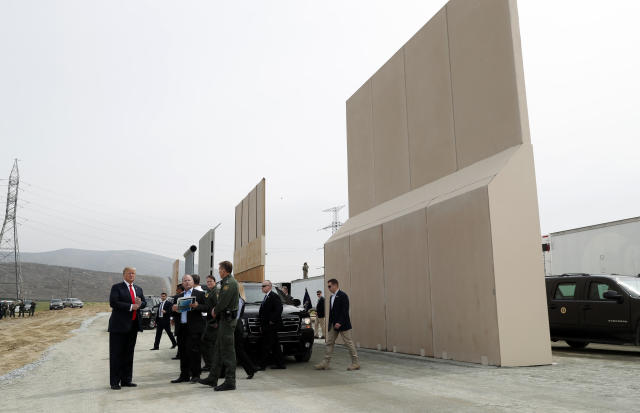 President Donald Trump tours U.S.-Mexico border wall prototypes near the Otay Mesa Port of Entry in San Diego. (Kevin Lamarque / Reuters)