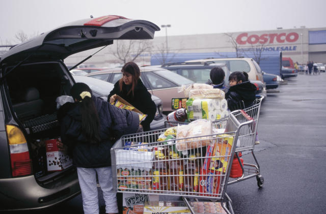 A family unloading carts after shopping at a Costco store in New Jersey.