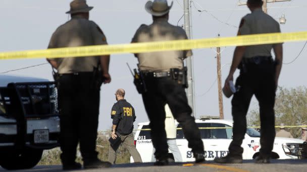 PHOTO: Law enforcement officials gather near the First Baptist Church following a shooting on Nov. 5, 2017 in Sutherland Springs, Texas. (Erich Schlegel/Getty Images)