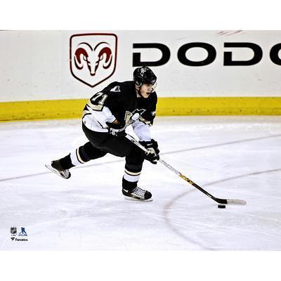 Bryan Rust Pittsburgh Penguins Unsigned Gold Alternate Jersey Skating vs.  Boston Bruins Photograph