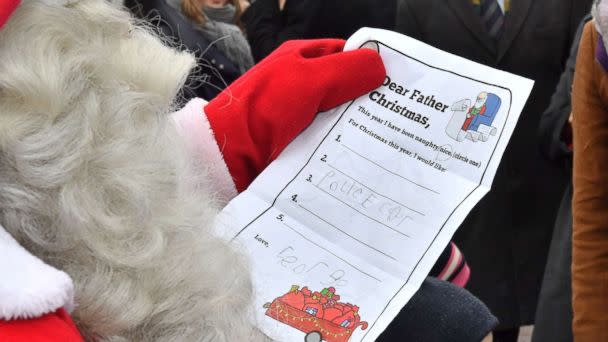 PHOTO: Prince William gives a Christmas list from Prince George to Santa Claus at Esplanade Park's Christmas market in Helsinki, Nov. 30, 2017 (Tim Rooke/REX/Shutterstock)