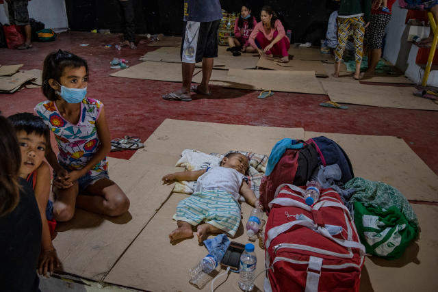 Residents who fled Taal's eruption at an evacuation center in Santo Thomas on Jan. 13. | Ezra Acayan—Getty Images