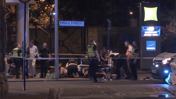 PHOTO: In this image made from PA Video footage, people receive medical attention in Thrale Street near London Bridge following a terrorist incident Saturday, June 3, 2017. (Federica De Caria/PA via AP)