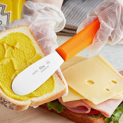 Choice 3 1/2 Scalloped Stainless Steel Sandwich Spreader with Yellow  Polypropylene Handle