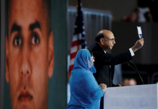 Khizr Khan, whose son Humayun (left) was killed serving in the U.S. Army, challenges Donald Trump to read the U.S. Constitution. (Photo: Lucy Nicholson/Reuters)