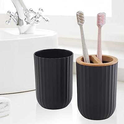 Dracelo 4-Piece Bathroom Accessory Set with Toothbrush Holder, Soap Dispenser, Cotton Jar, Tray in Black