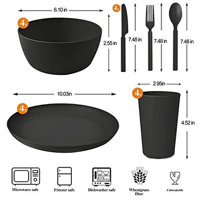 Black plastic and paper plates, napkins, cups, bowls, and utensils