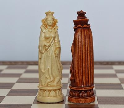 Medieval style chess pieces with a castle