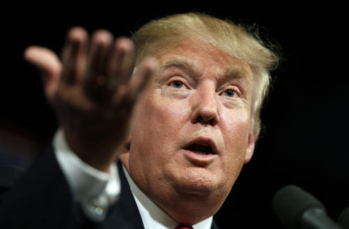 FILE- In this June 16, 2015 file photo, Republican presidential candidate Donald Trump speaks to supporters during a rally in Des Moines, Iowa. Donald Trump's lawyers said Trump and the Miss Universe pageant have sued Univision for $500 million on Tuesday, June 30, 2015, claiming Trump's First Amendment rights were violated when the company backed out of its contract to air the Miss USA contest. (AP Photo/Charlie Neibergall, File)