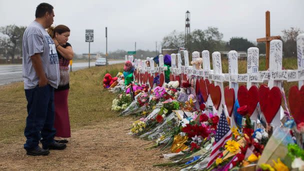 PHOTO: People visit the makeshift memorial near the First Baptist Church in Sutherland Springs, Texas, Nov. 12, 2017, honoring the 25 people including a pregnant woman whose unborn baby also died on Nov. 5, 2017. (Courtney Sacco/Caller-Times via USA TODAY NETWORK)