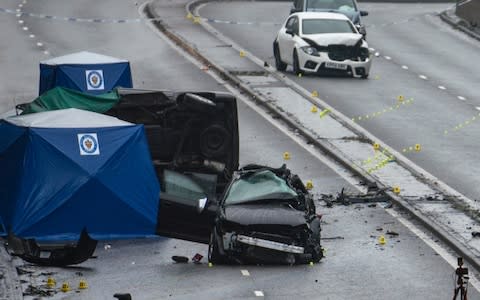Police officers work at the scene of a multi-vehicle crash on Lee Bank Middleway, Edgbaston - Credit: Christopher Furlong/Getty Images
