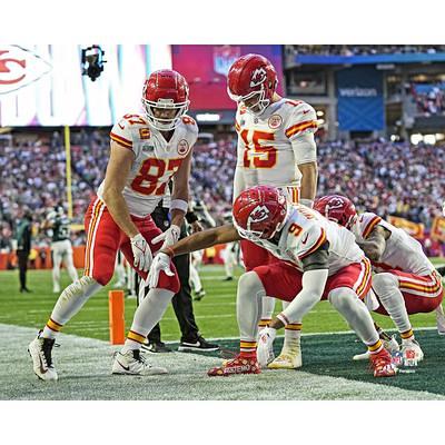 Patrick Mahomes Kansas City Chiefs Unsigned Super Bowl LVII Champions Celebrating with The Lombardi Trophy Photograph