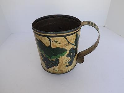 Rustic enamel coffee cup with word coffee on it and decorative