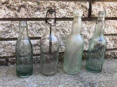 Four Vintage Clear Glass Bottles