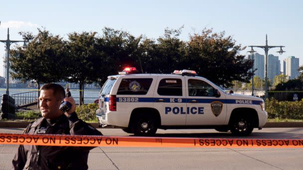 PHOTO: Police gather at the scene after reports of multiple people injured after a truck plowed through a bike path in lower Manhattan, Oct. 31, 2017, in New York City. (Andy Kiss/Getty Images)