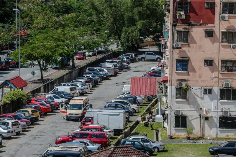 An ambulance is seen at Taman Sri Murni in Selayang during the enhanced movement control order (EMCO) in Kuala Lumpur April 22, 2020. ― Picture by Firdaus Latif