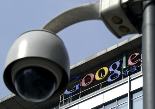 FILE - In this March 23, 2010 file photo, a surveillance camera is seen in front of the Google China headquarters in Beijing, China. Connections to Google Inc.'s popular email service have been blocked in China amid efforts by the government to limit access to the company's services. Records from Google's Transparency Report show online traffic from China to Gmail dropped to zero on Saturday, Dec. 27 although there was a small pickup on Monday, Dec. 29, 2014. (AP Photo/Andy Wong, File)