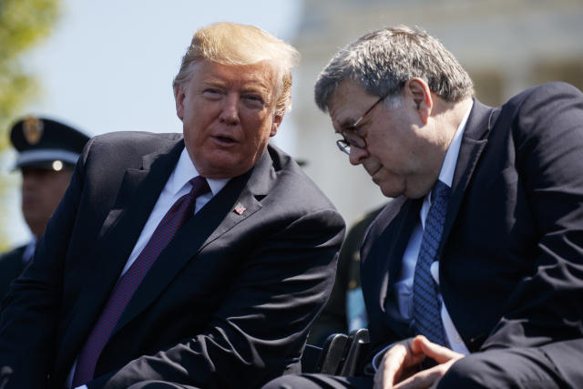 President Trump talks with Attorney General William Barr during the 38th Annual National Peace Officers' Memorial Service in Washington, D.C., Wednesday. (AP Photo/Evan Vucci)