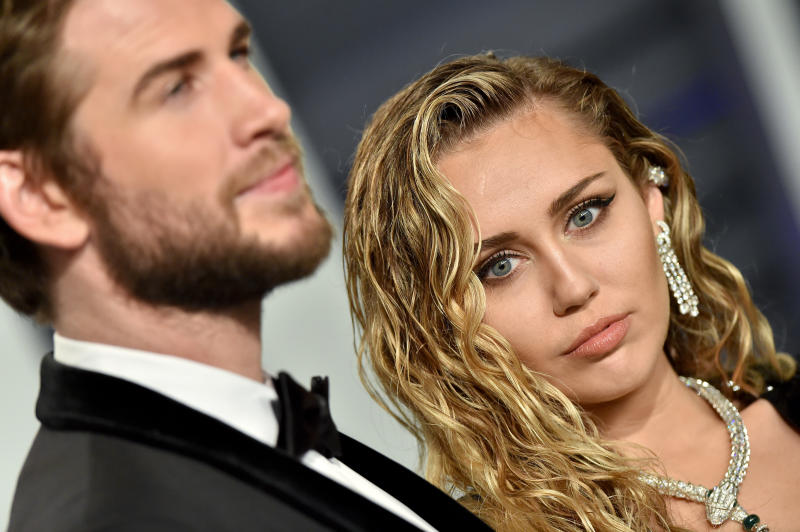 BEVERLY HILLS, CALIFORNIA - FEBRUARY 24: Miley Cyrus and Liam Hemsworth attend the 2019 Vanity Fair Oscar Party Hosted By Radhika Jones at Wallis Annenberg Center for the Performing Arts on February 24, 2019 in Beverly Hills, California. (Photo by Axelle/Bauer-Griffin/FilmMagic)