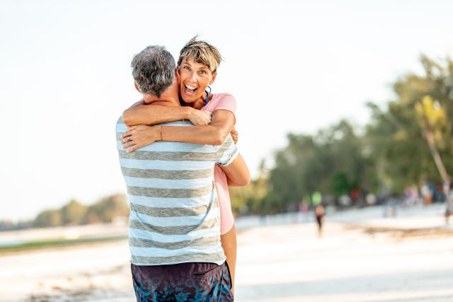 Mid Adult Woman Enjoying on Tropical Vacations With Her Partner.