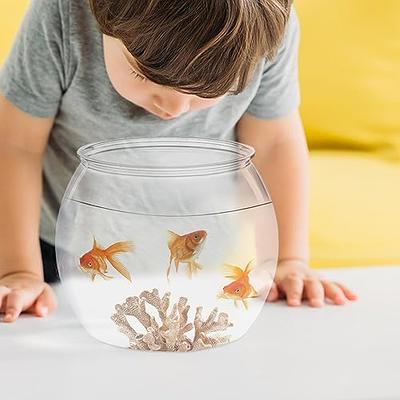 goldfish in a bowl with plant