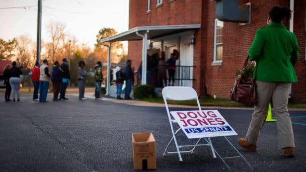 PHOTO: A woman walks over to get in line to vote at Beulah Baptist Church polling station in Montgomery, Ala. on Dec. 12, 2017. (Jim Watson/AFP/Getty Images)