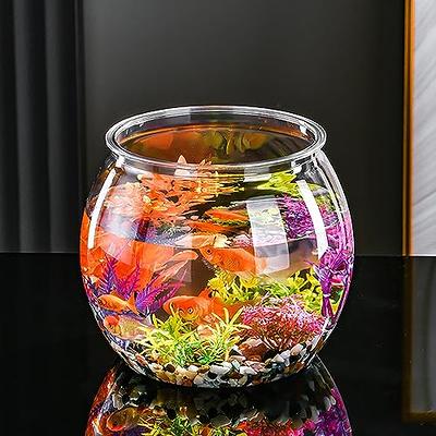 goldfish in a bowl with plant